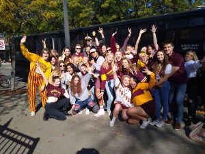 Homecoming group celebrating aboard a Rent My Party Bus limo bus