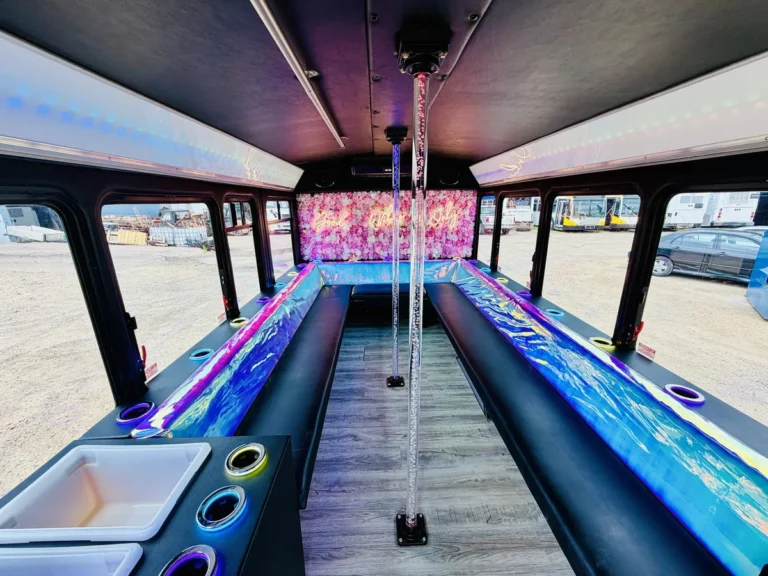 Cabin of The Mini Unicorn party bus with LED lighting and bench seats