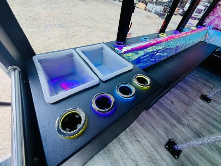 White cooler bins and neon-ringed light-up cup holders on the Mini Unicorn bar