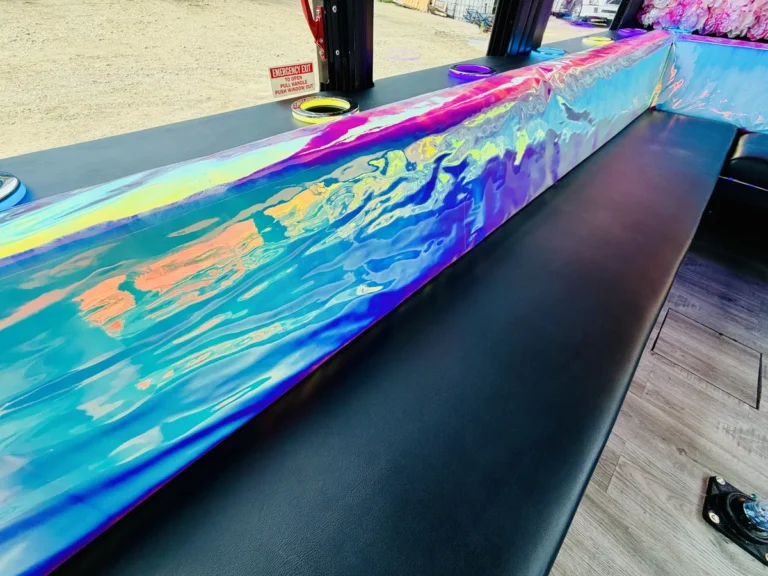 Close-up detail of the iridescent holographic wrap on The Mini Unicorn party bus
