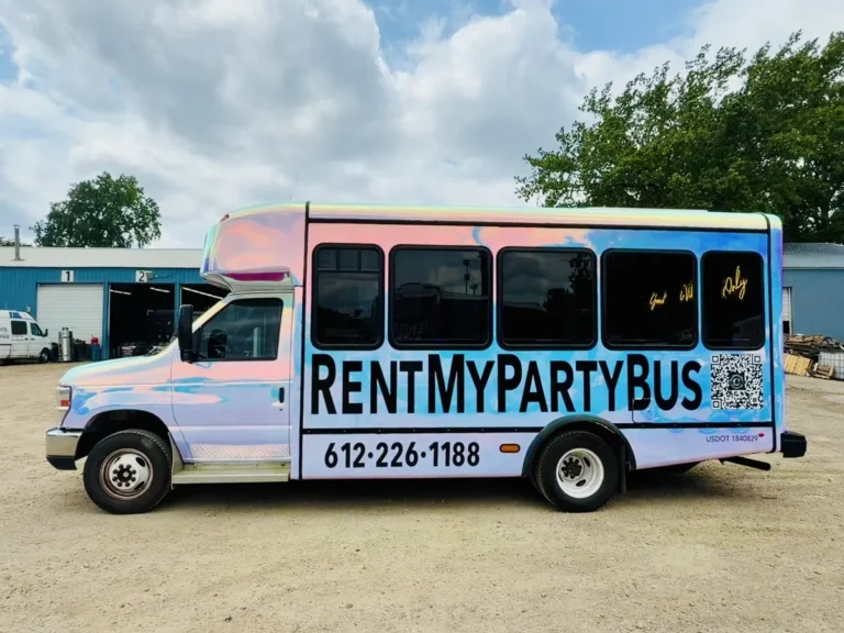 Driver-side front view of The Mini Unicorn party bus with call-or-text number on the wrap