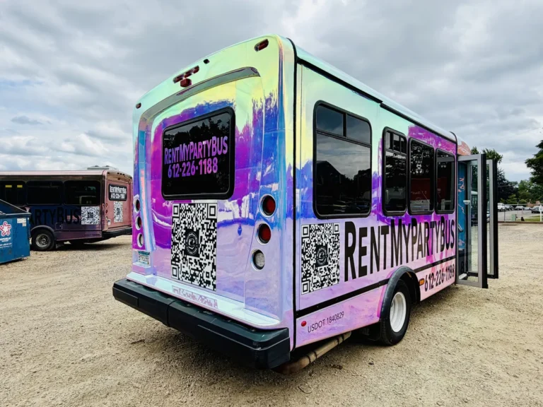 Rear three-quarter view of the unicorn-wrapped Mini Unicorn party bus in Minneapolis