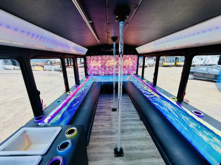 Bench seating and big windows inside The Mini Unicorn party bus